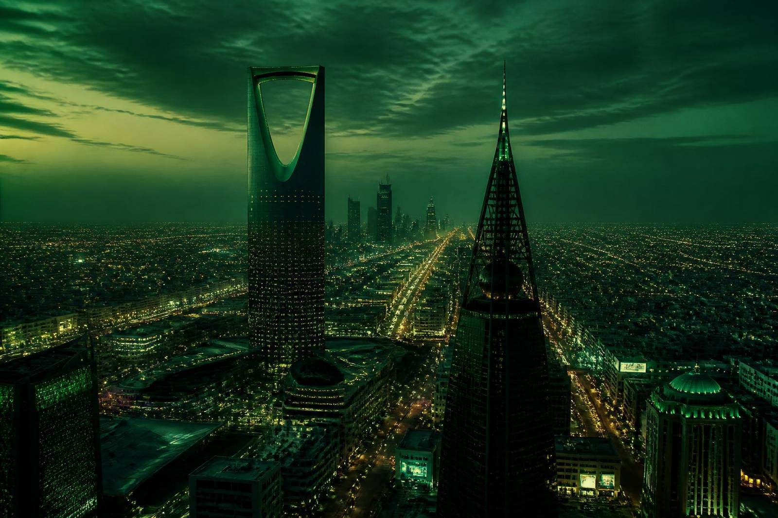 Cinematic green-toned aerial view of the Riyadh skyline at dusk